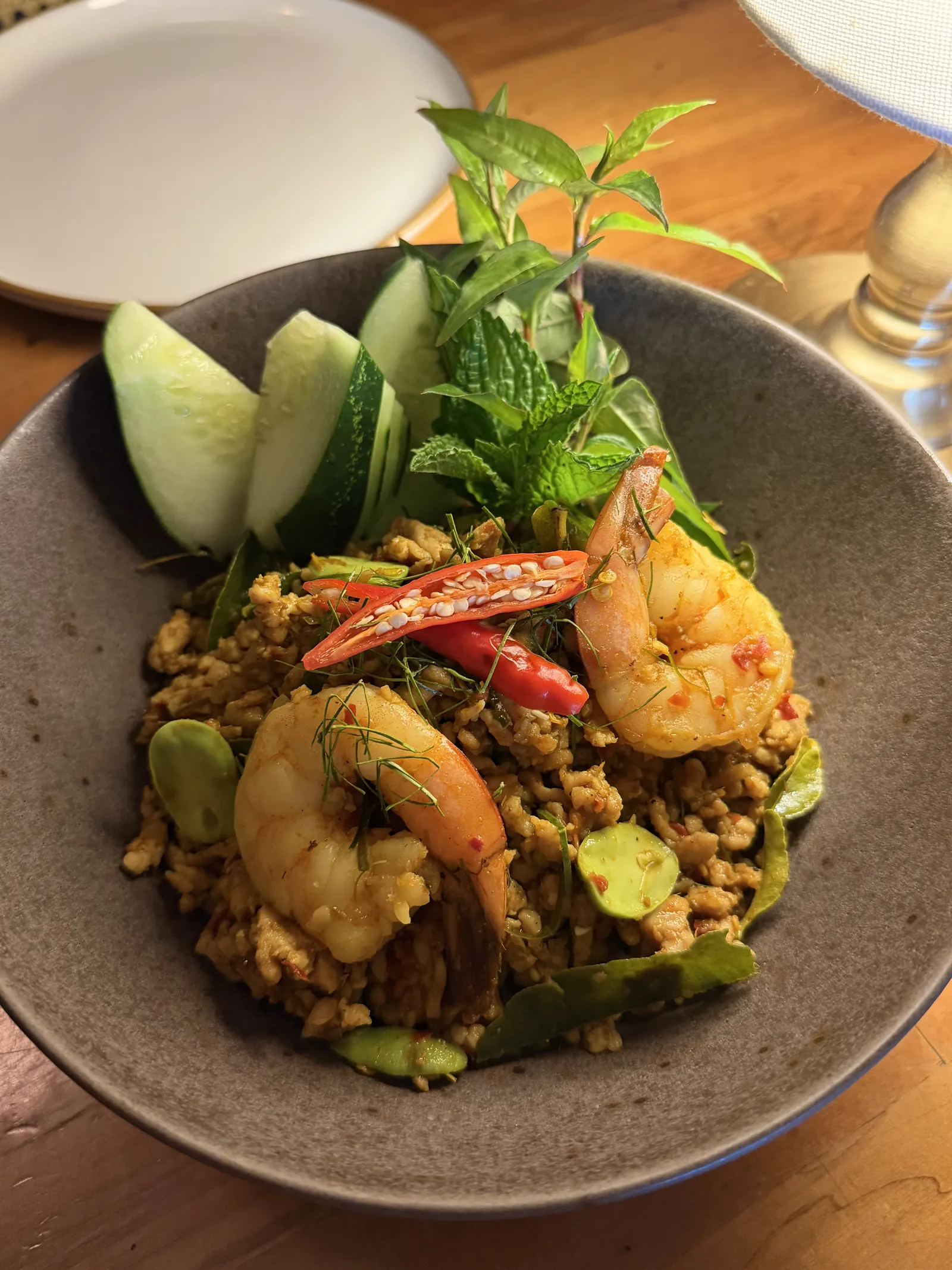 Prawns and minced pork in a dry Southern Thai curry, with chilies, fresh herbs and cucumber